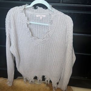 Super cute frayed sweater.